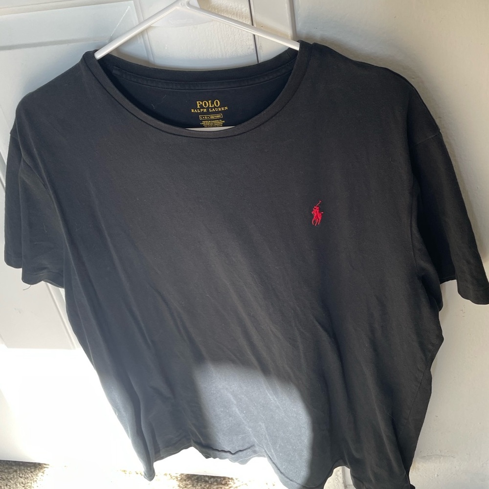 Size medium black polo t-shirt with red logo
